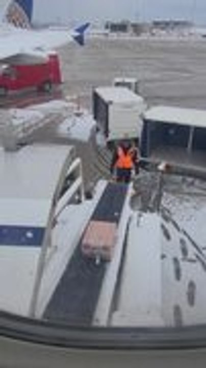 Suitcase Slides Back On Conveyor Belt