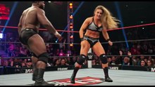 Female bodybuilders beat and toy with men in a wrestling arena.