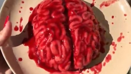 Baker transforms simple ingredients into a gory yet irresistible Halloween 'brain' cake