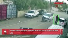 Otomobille çarpışan motosiklet sürücüsü havada taklalar attı