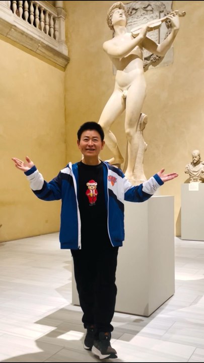 Male beauty and art. Nelson Wang posed in front of the naked Orpheus statue. Photographed on December 6, 2025 at the Metropolitan Museum of Art on 1000 Fifth Avenue in New York City. The Orpheus statue was created by Cristoforo Stati