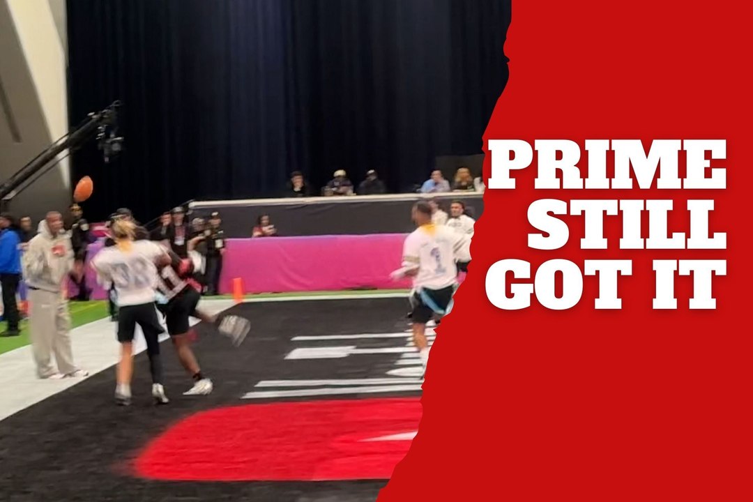 Deion Sanders catches an unexpected interception at the Super Bowl Flag Football Game