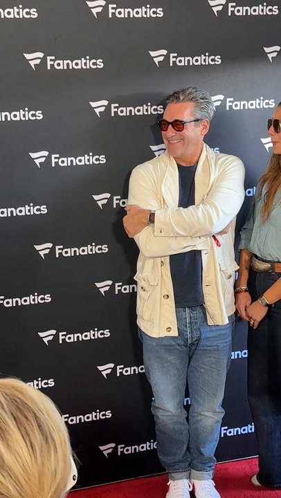 Jon Hamm admiring Ciara and Russell Wilson on Michael Rubin's Fanatics Super Bowl Party red carpet