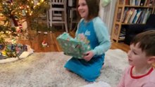 The excited kids give presents to each other while playing Secret Santa