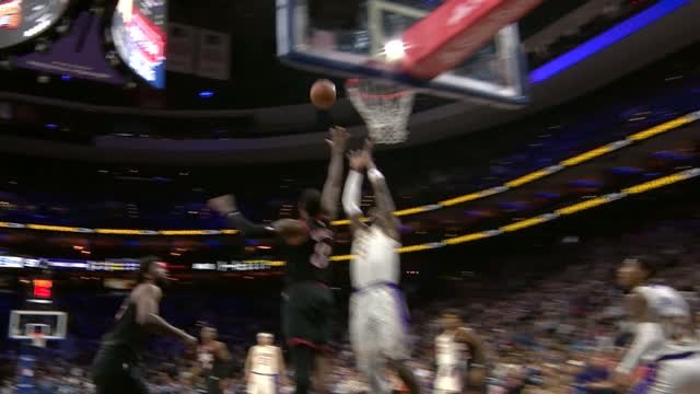 Doncic combines with Deandre Ayton for the alley-oop