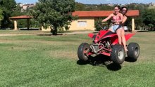 Two girls ride a quad bike at a farm and end up crashing into a tree