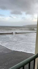 Waves crash over Laxey Promenade amid Storm Bram