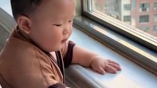 Cute Baby by the Window Holding a Toy – Adorable Morning Moment