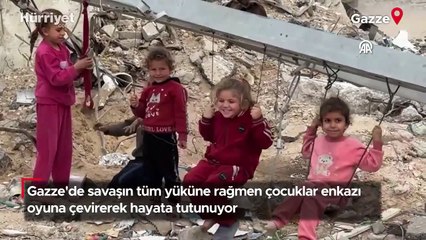 Gazze'de savaşın tüm yüküne rağmen çocuklar enkazı oyuna çevirerek hayata tutunuyor
