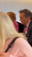 Friends and family hold pictures of Emily Finn as they exit courtroom during Austin Lynch’s hearing
