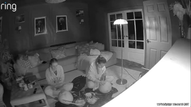 Girl hurts herself while carving pumpkins with her friend for Halloween