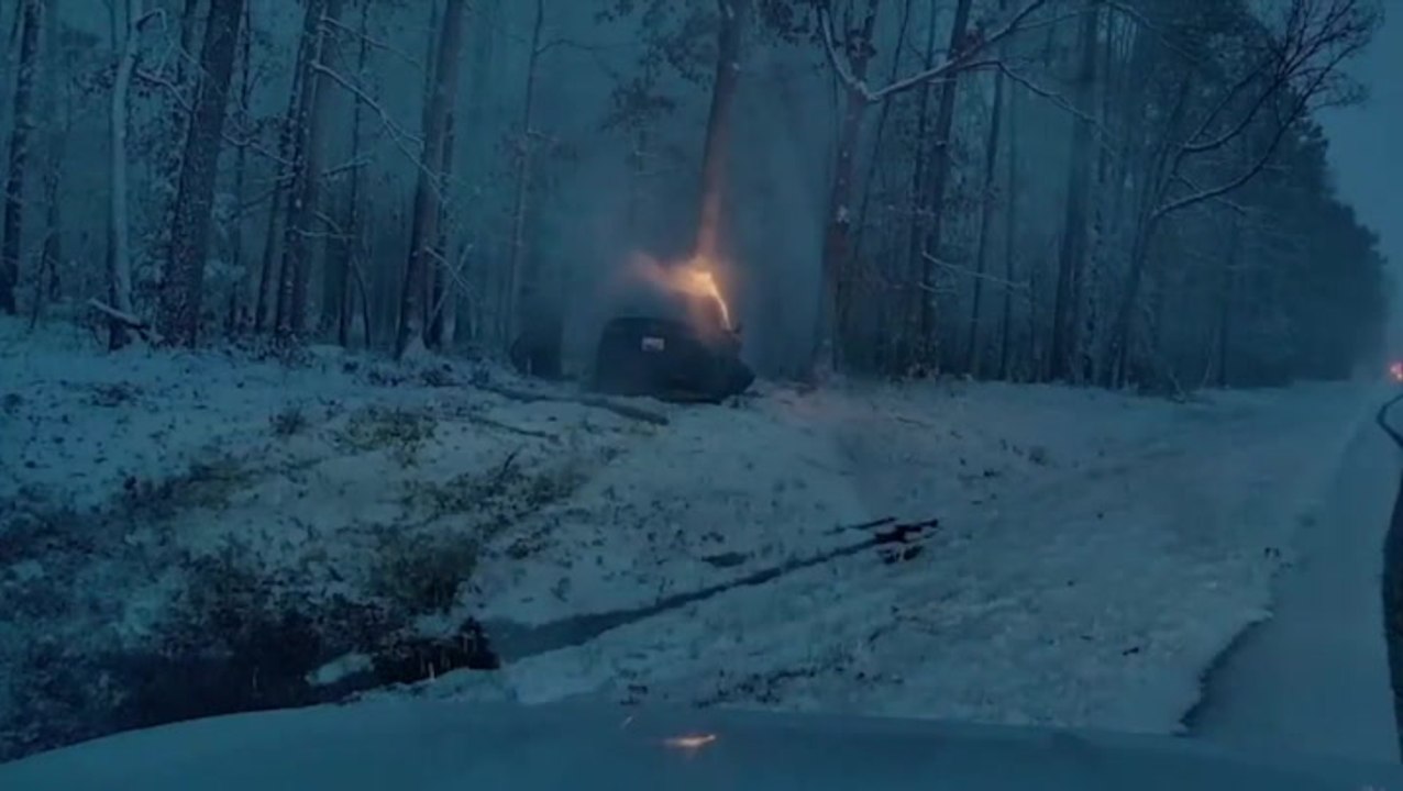 Driver trapped in burning Tesla saved in dramatic rescue