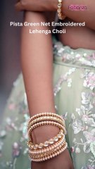 Turn heads this season with our Pista Green Net Embroidered Lehenga Choli ✨