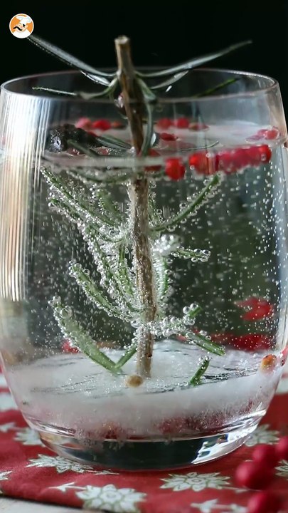 Christmas cocktail with a snow-covered fir tree inside