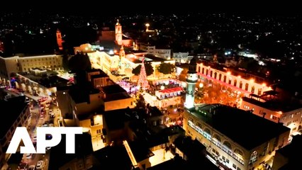 Jerusalem’s Christmas Tree Lights Up as Santas Take Over Bethlehem Streets! APT