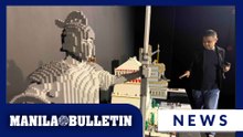 Visitors check out different LEGO builds at Brickman™