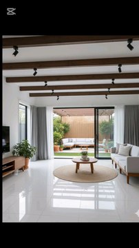 ✨ Check out this sleek modern oasis! ✨🔥‎‎🏡 *Living Room*: White glossy tiles, dark wood ceiling beams & track lights 💡, light gray sofa with wood legs, jute rug & wooden coffee table 🌱, big glass doors opening to the backyard vibes.