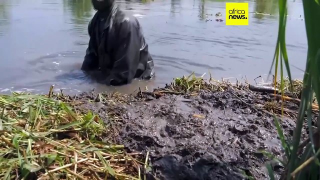 Dinka people rebuild flood defences by hand each day to stop homes sinking