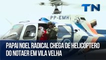 Papai Noel radical chega de helicóptero do Notaer em Vila Velha
