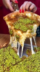 CHEESY KUNAFA PIZZA from Ayat NYC! 🧀🍕🔥🤤 Insane! Who’s hungry？ #DEVOURPOWER