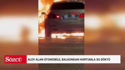 Alev alan otomobile, balkondan hortumla su döktü; o anlar kamerada