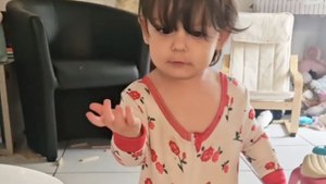 Cute toddler’s attempt to hide toys in pajamas results in a cartoonish walking style