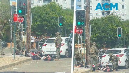 Armed police detain group involved with 'potential violent act' in Sydney