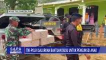 TNI-Polri Bagikan Bantuan Susu Presiden Prabowo ke Pengungsi Anak-Anak di Batang Toru