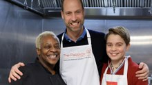 Prince George helps serve Christmas dinner at homeless charity
