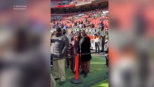 Deion Sanders watches his son Shedeur Sanders play in the company of someone special