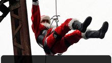 Guatemalan firefighter rappels from bridge as Santa to surprise children