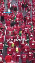 Marea roja en Madrid: Miles corren disfrazados de Santaclós por causa solidaria