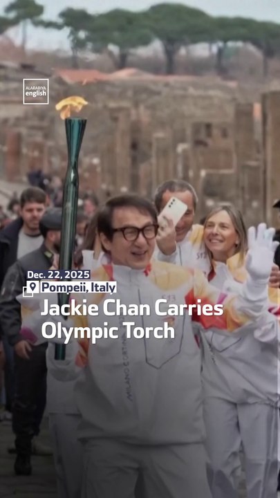 Jackie Chan Carries Olympic Torch