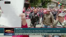 Workers in Bolivia march in protest against decree imposing neoliberal economic policy