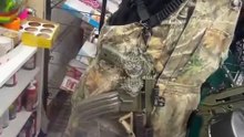 Tennessee man walks into a convenience store carrying multiple loaded guns, including two Kel-Tec PLR-16 pistols, one with a drum magazine and another with a 60-round magazine, plus additional handguns.