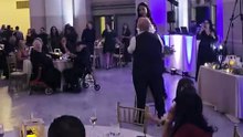 Woman attempts to catch wedding bouquet but ends up falling in a comical twist of fate