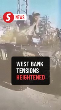 Israeli man hits Palestinian during prayer