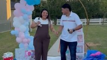 Gender reveal: Parents-to-be reveal they are having a baby girl with pink spray