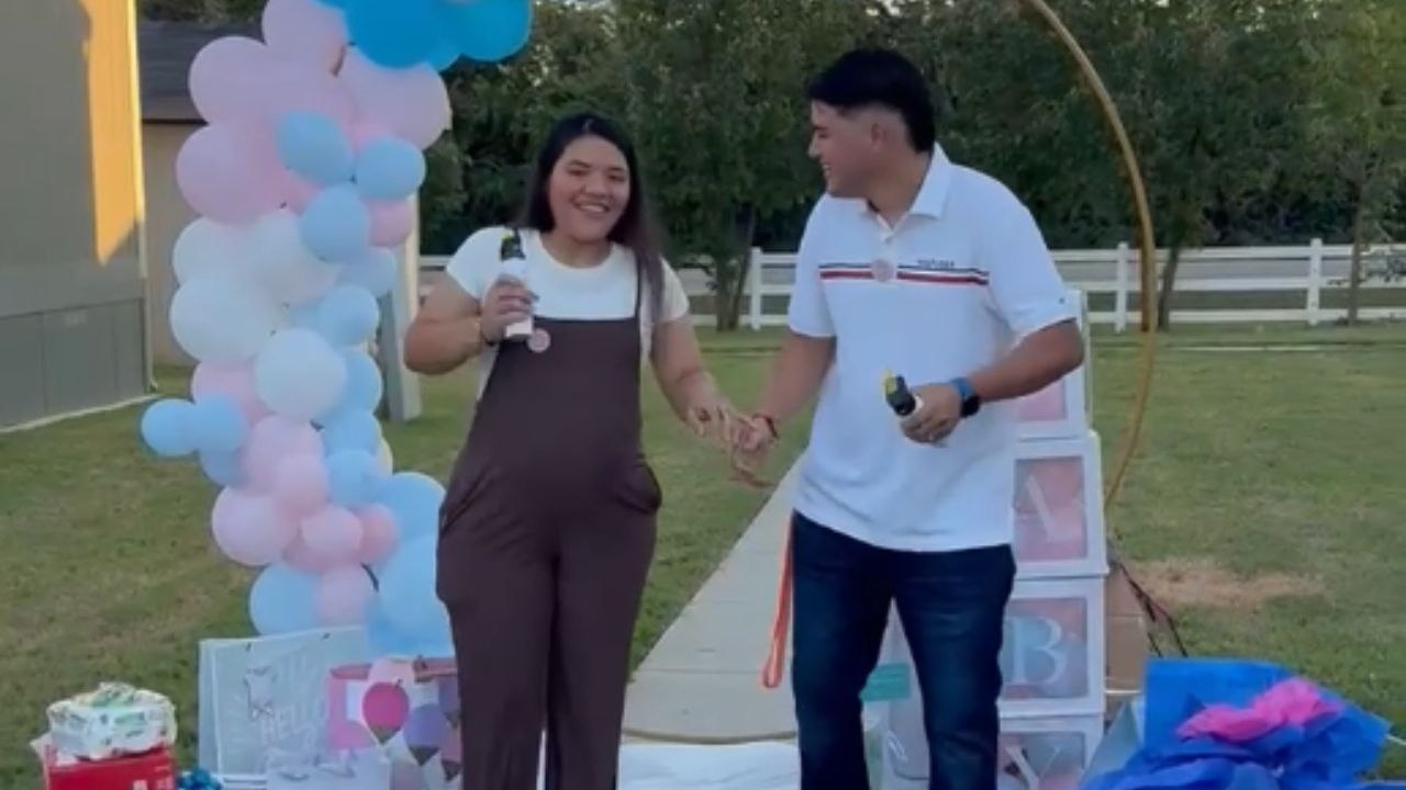 Gender reveal: Parents-to-be reveal they are having a baby girl with pink spray