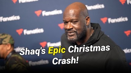 Shaquille O’Neal crashes through ESPN studio screen during Christmas halftime show.