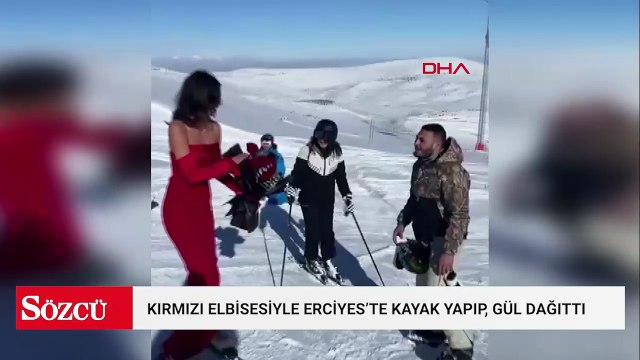 Kırmızı elbisesiyle Erciyes’te kayak yapıp, gül dağıttı