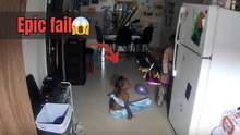 Funny home security footage shows child falling over while trying to carry boxes