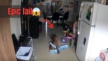 Funny home security footage shows child falling over while trying to carry boxes