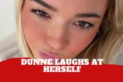 Olivia Dunne laughs at her awkward paparazzi moment