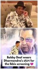 A touching moment as Bobby Deol wears Dharmendra’s shirt for the Ikkis screening