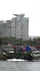 Taiwan drops "explosive barrels" in river defense drill as China encircles island