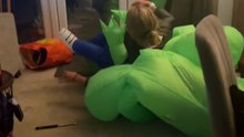 Halloween fun: Two moms pretend to be carried away by inflatable aliens