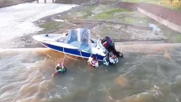Watch: Men clinging to boat dangling over edge of 130ft dam saved by quick-thinking employee