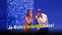 Ja Rule leans behind Jennifer Lopez and stares at her shaking her backside during their “Ain’t It Funny” performance in Las Vegas