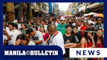 Catholic devotees line up at Quinta Market for Sunday Mass at Quiapo Church, Manila